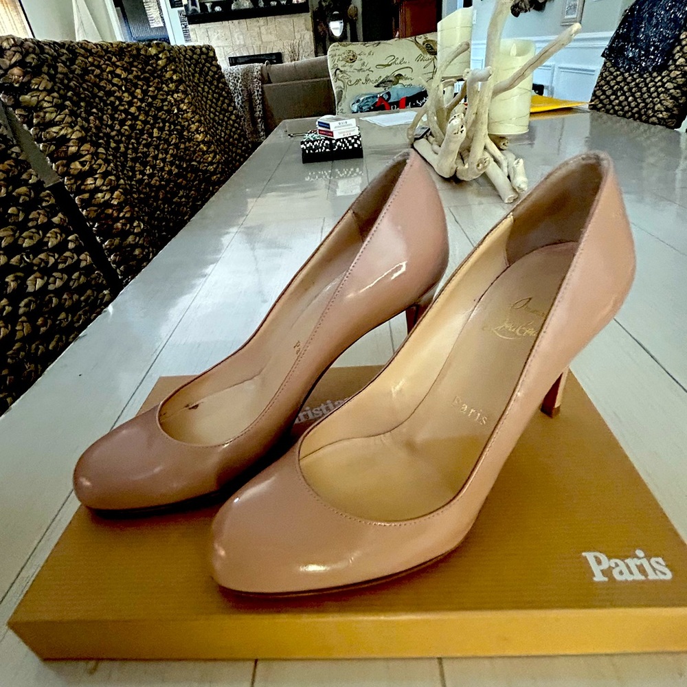 Used in excellent condition including new red soles.  Worn only a few times